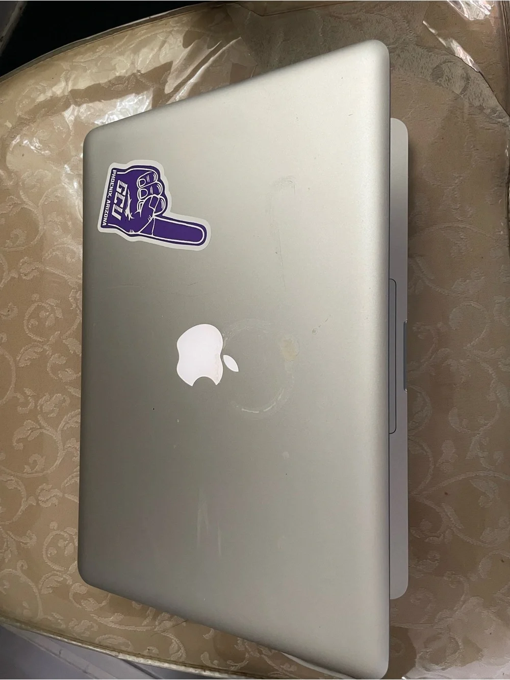Apple MacBook Pro Silver with Black Keyboard and Sticker